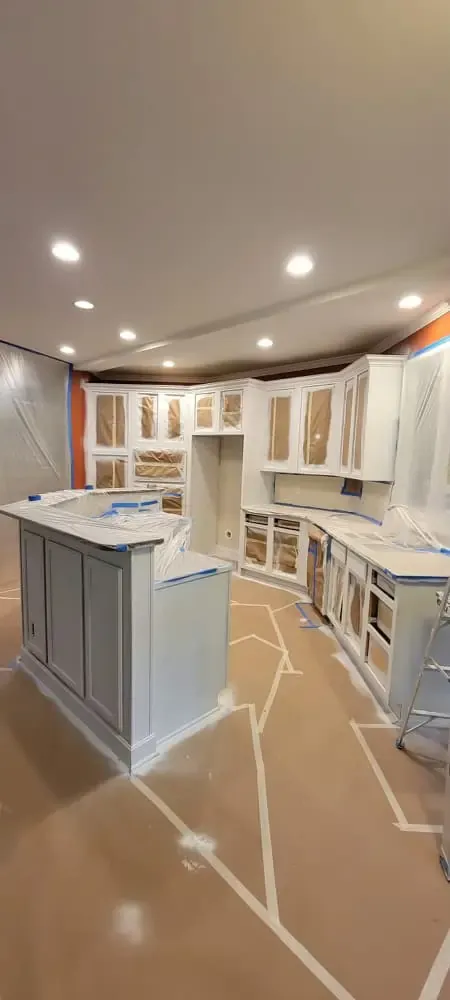 Full kitchen cabinet repaint — sage green for the win.