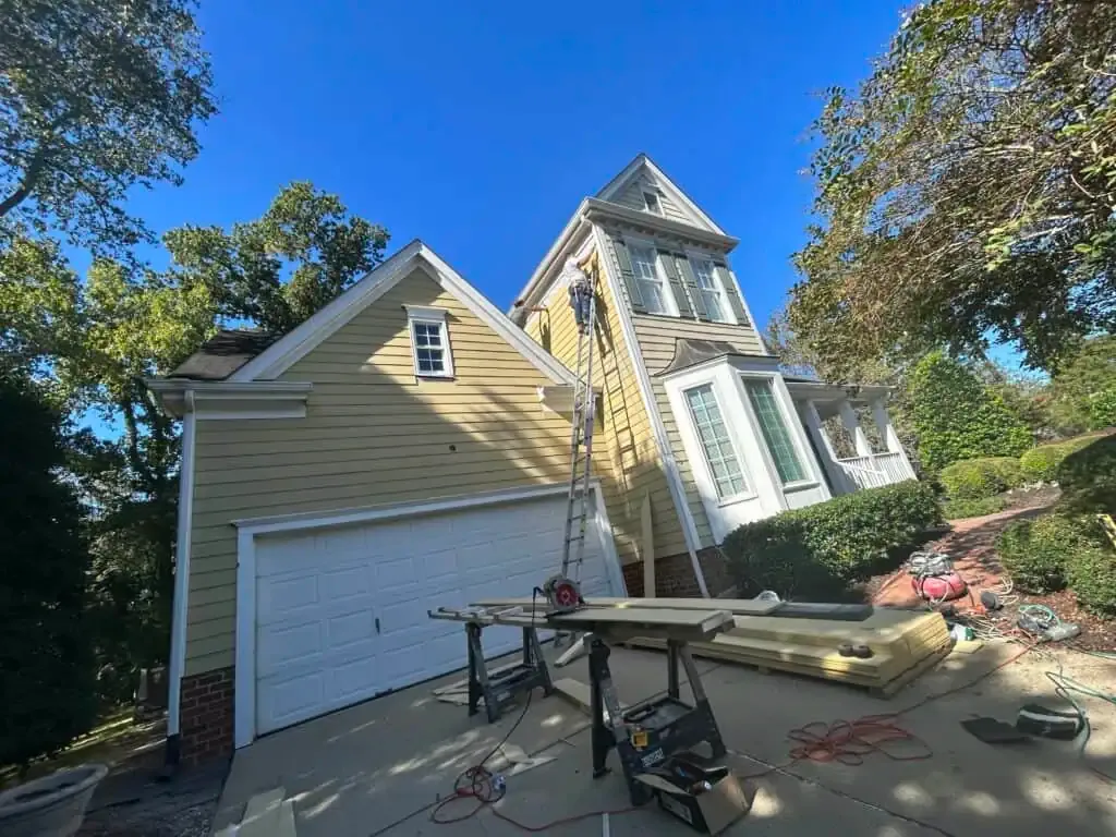 Cedar siding repaint with UV-resistant Sherwin-Williams Duration.