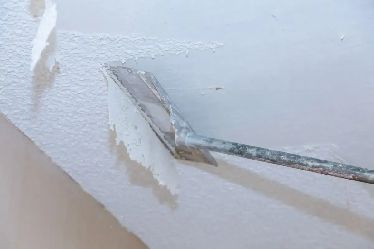 Popcorn ceiling removed and replaced with smooth finish.
